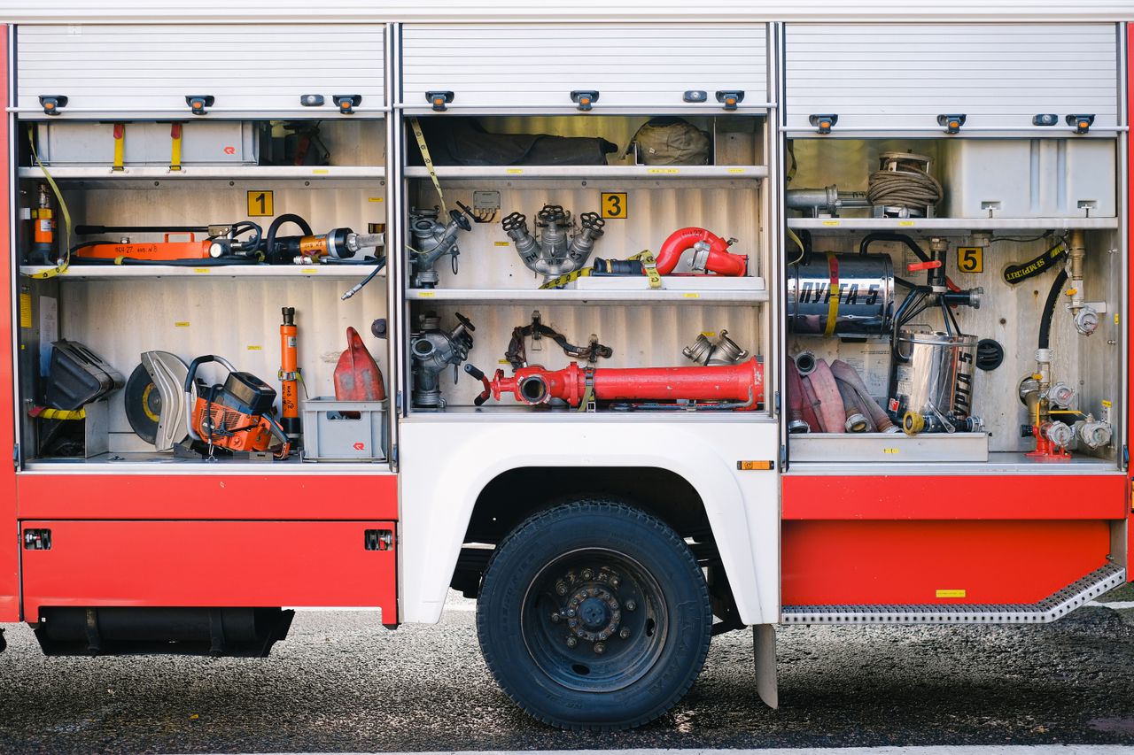 The Art of Drawing Readers In: Your attractive post title goes here Close-up view of fire truck compartments filled with essential firefighting tools and equipment.